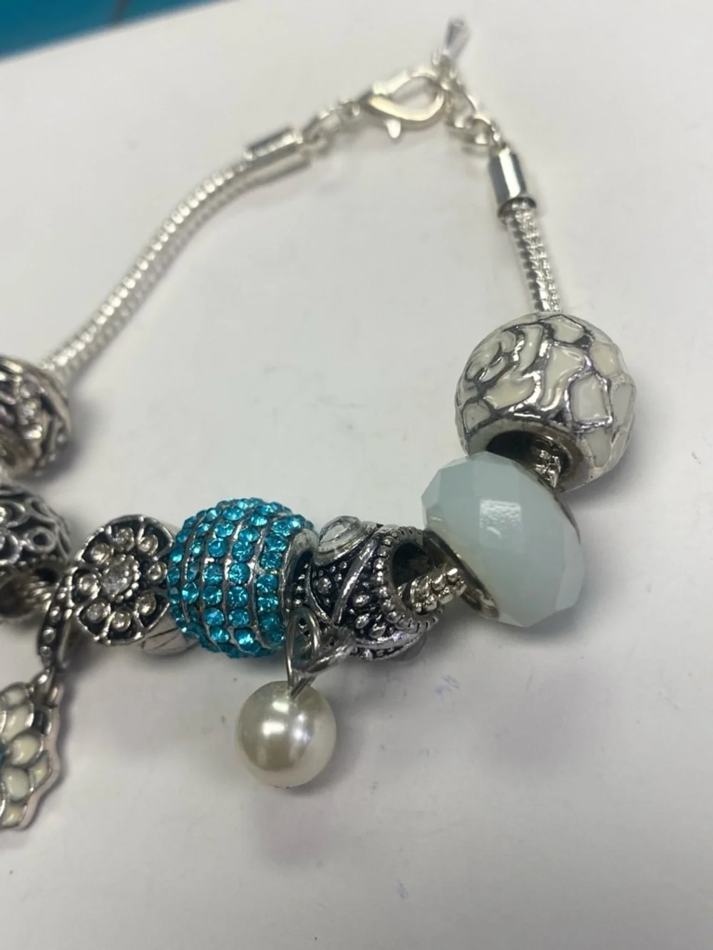 Silver tone Charm Bracelet with Turquoise Crystal and Pearl Accents